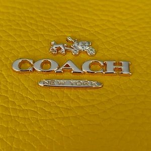 Coach handbag in yellow and white